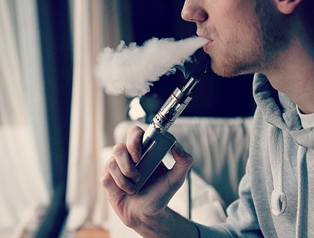 photo of a man vaping