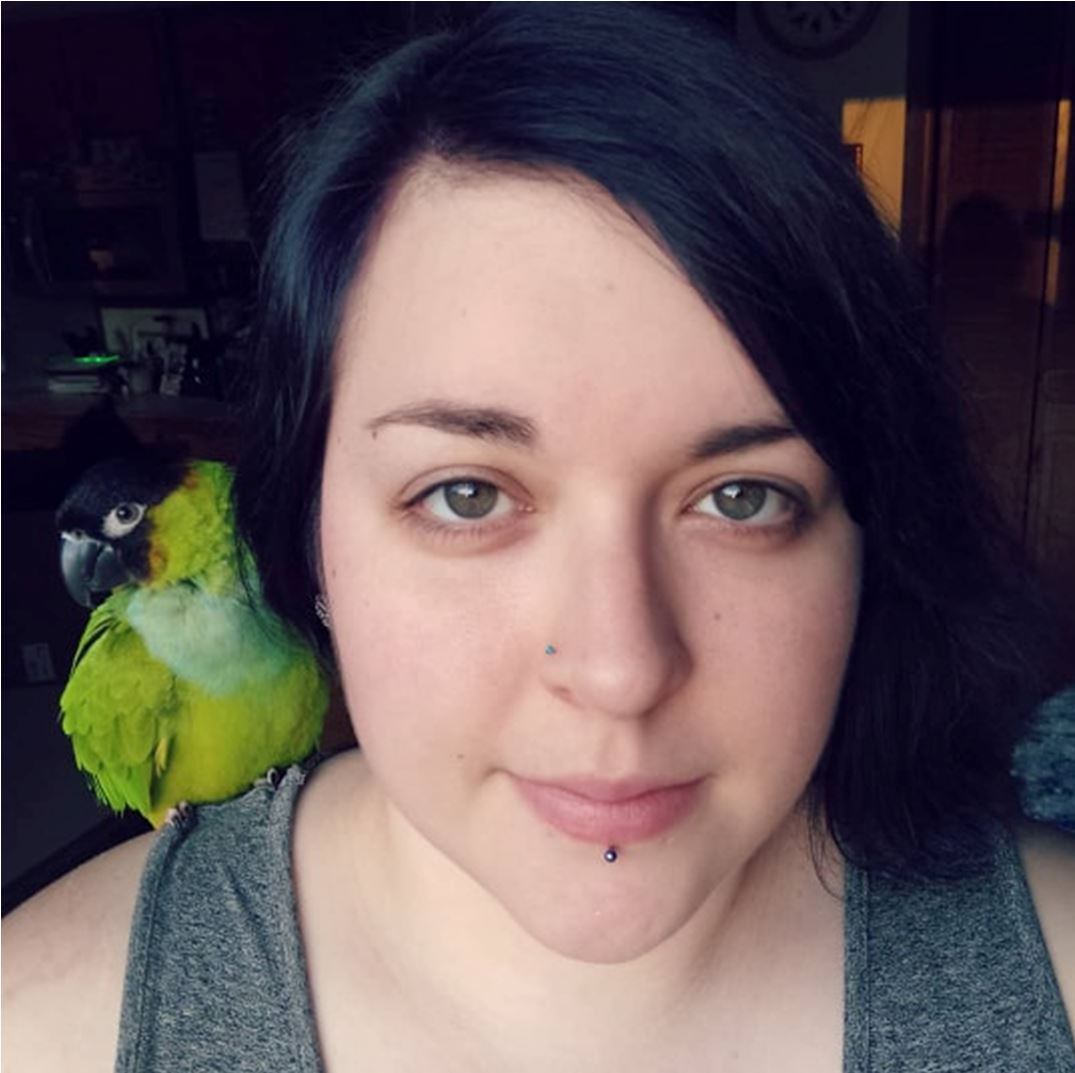 Photo of Rachel Doktor and her parrot, Pickles. 